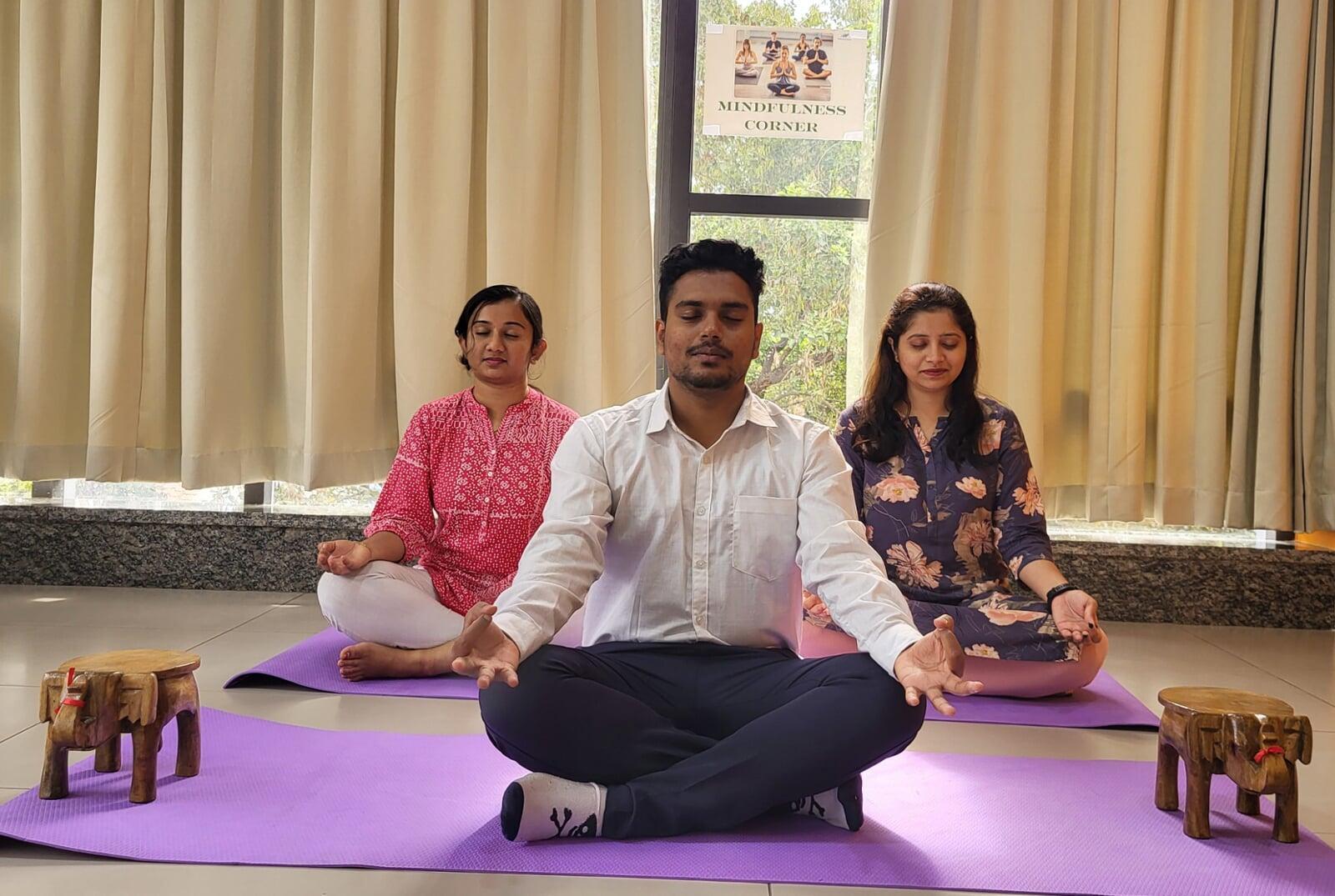 Team meditating in mindfulness corner